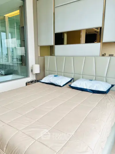 Modern bedroom with stylish headboard and large window view