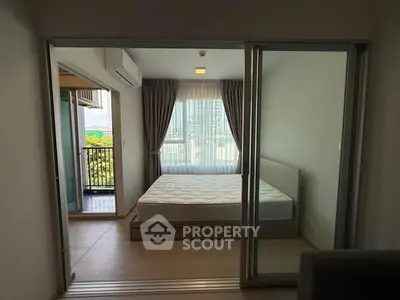 Modern bedroom with balcony view in urban apartment