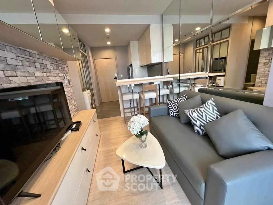 Modern living room with stylish decor and open kitchen layout