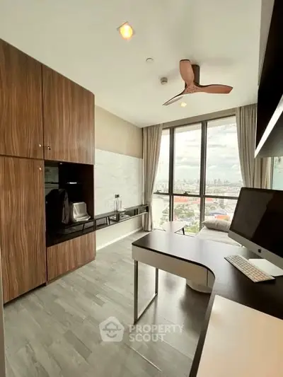 Modern study room with city view, sleek desk, and built-in storage cabinets.