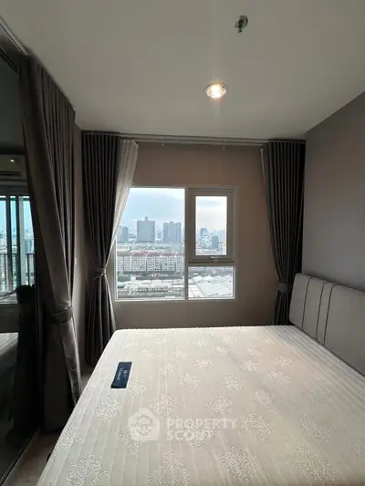 Modern bedroom with city view, featuring large window and elegant curtains.