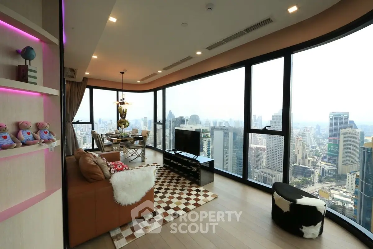 Luxurious corner unit living room with panoramic city views and modern decor