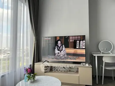 Modern living room with TV, stylish furniture, and large window with city view.