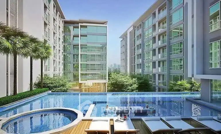 Luxurious modern apartment complex with stunning pool and lush greenery.