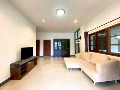 Spacious living room with modern sofa and entertainment unit