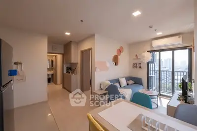 Modern open-plan living room with city view balcony in stylish apartment