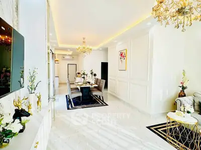 Luxurious living room with elegant chandeliers and modern decor