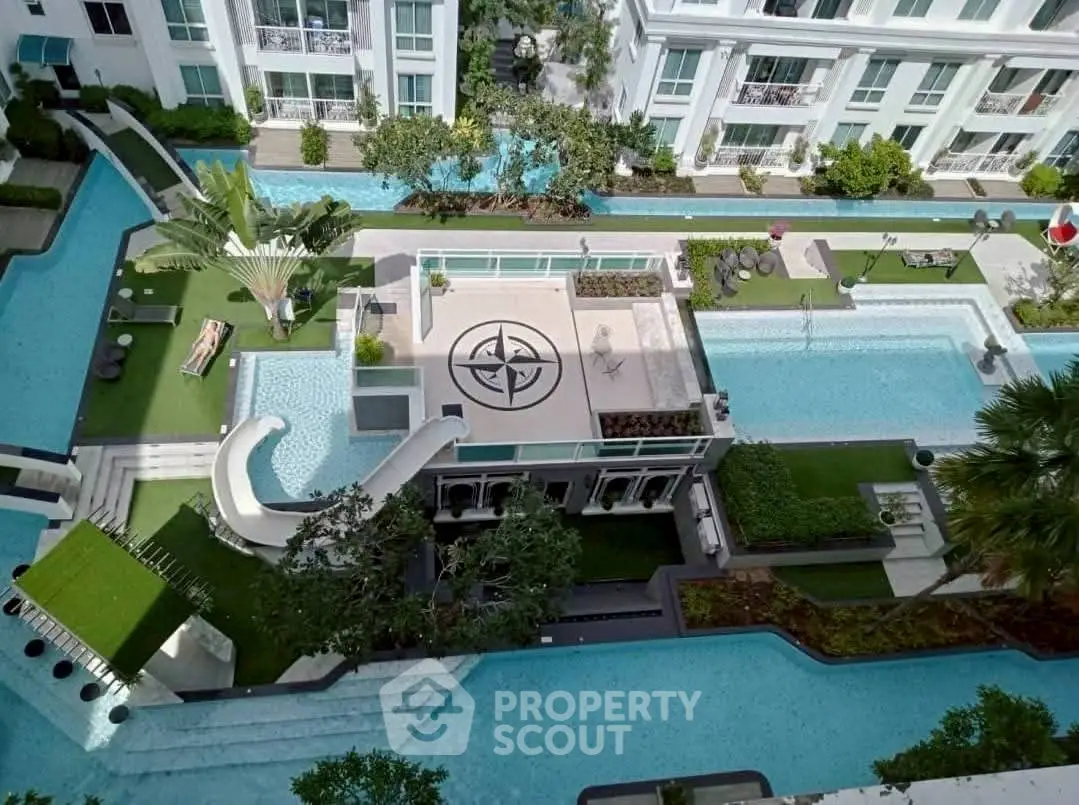 Luxurious apartment complex with stunning pool and lush gardens