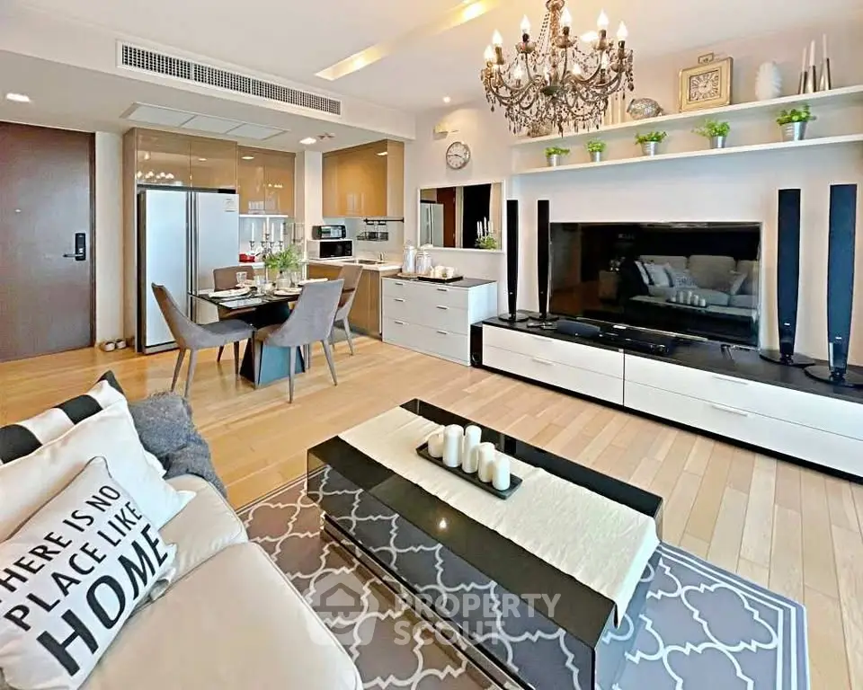 Luxurious open-plan living room with elegant decor and modern kitchen