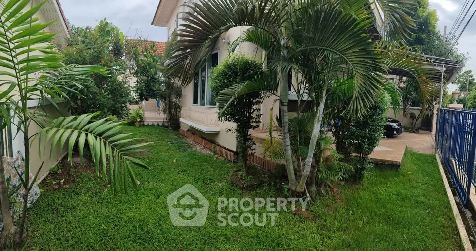 Charming garden view of a suburban home with lush greenery and cozy ambiance.