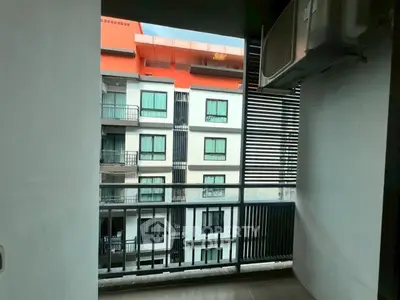 Modern apartment balcony with city view and air conditioning unit