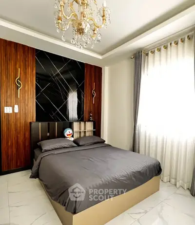 Luxurious bedroom with elegant chandelier and modern decor