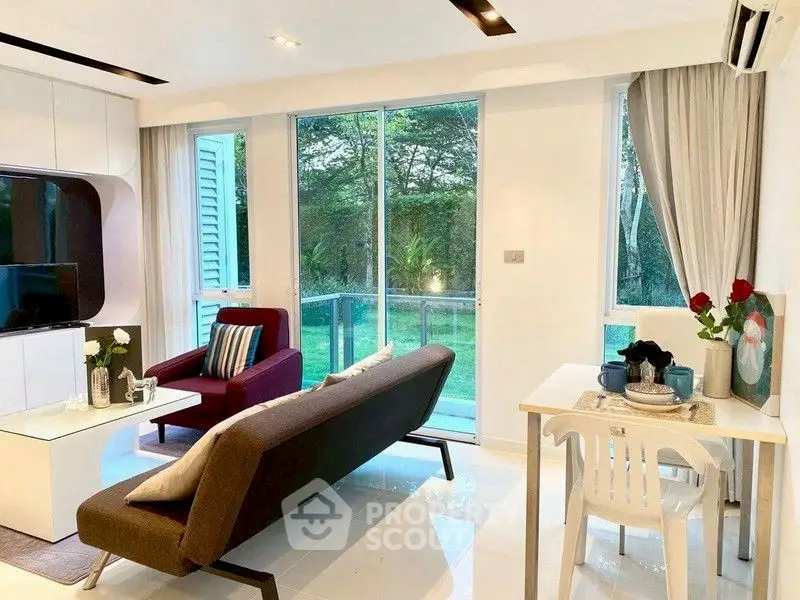 Modern living room with garden view, stylish furniture, and natural light.