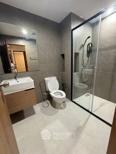 Modern bathroom with glass shower and sleek fixtures