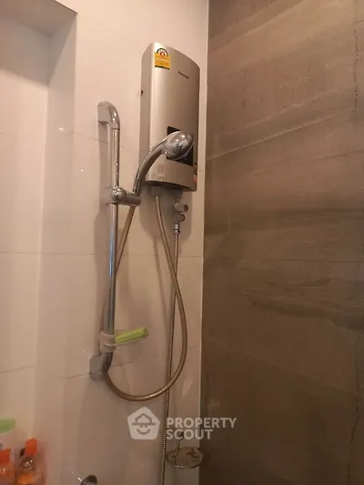 Modern bathroom with sleek shower unit and elegant tile design