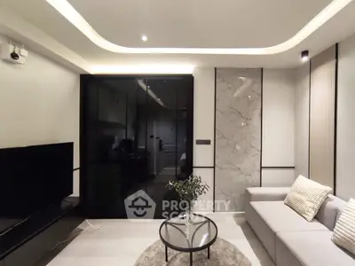 Modern living room with sleek design and elegant lighting
