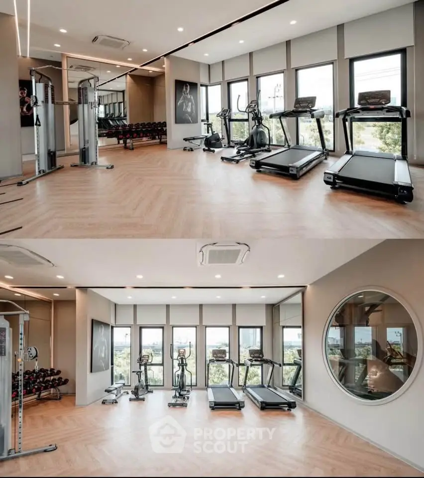 Modern gym with state-of-the-art equipment and large windows offering scenic views.