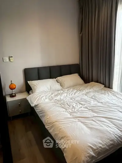 Cozy bedroom with modern decor and natural light