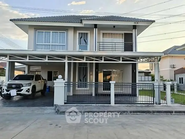 Modern two-story house with carport and spacious driveway