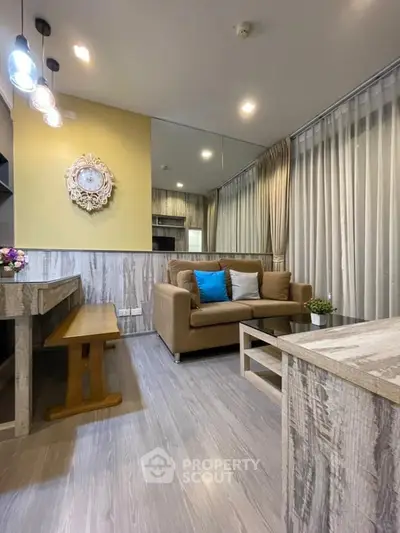 Stylish living room with modern decor, cozy sofa, and elegant lighting in a contemporary apartment.
