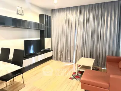 Modern living room with sleek furniture and elegant curtains