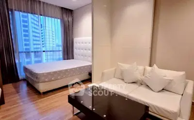 Modern bedroom with city view, featuring stylish furniture and elegant decor.
