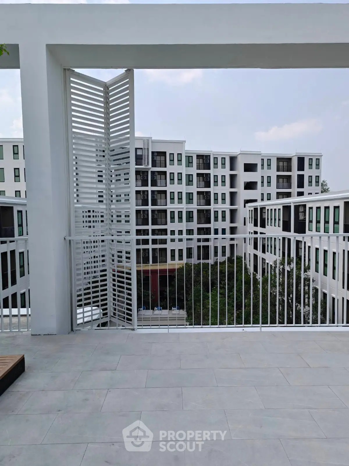 Modern apartment complex with spacious balcony and sleek design