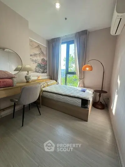 Cozy bedroom with natural light and modern decor