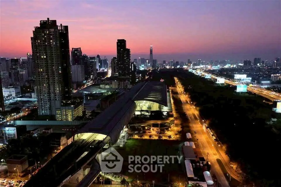 Stunning cityscape view at dusk showcasing urban skyline and illuminated streets.