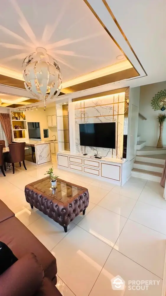 Luxurious living room with elegant decor and modern entertainment center