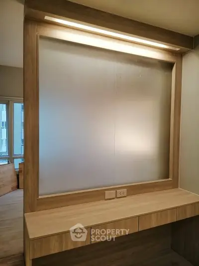 Modern study area with built-in desk and frosted glass window