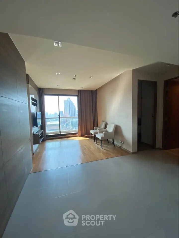 Spacious modern living room with city view and elegant decor