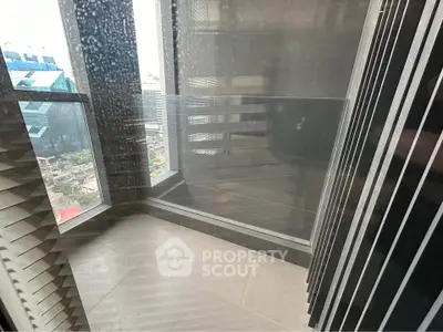 Modern high-rise balcony with city view and sleek design elements.