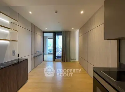 Modern open-plan kitchen with sleek design and city view