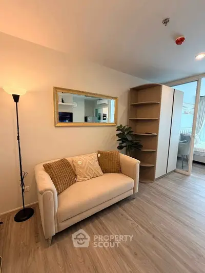 Modern living room with cozy sofa, stylish decor, and open layout in a contemporary apartment.