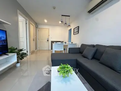 Modern living room with sleek furniture and stylish decor in a contemporary apartment.