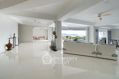 Spacious modern living room with panoramic views and elegant decor