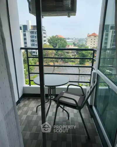 Charming balcony with city view, perfect for relaxing and enjoying the outdoors.