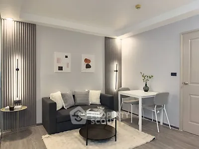 Modern living room with stylish decor and cozy seating area, perfect for relaxation and entertaining.