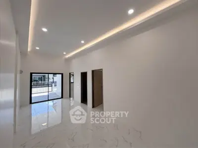 Spacious modern living room with elegant lighting and marble flooring