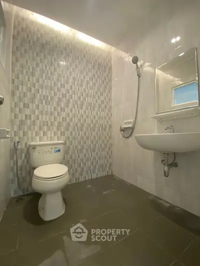 Modern bathroom with sleek tiles and contemporary fixtures