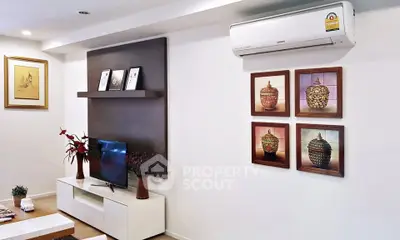 Modern living room with stylish decor and wall-mounted air conditioner