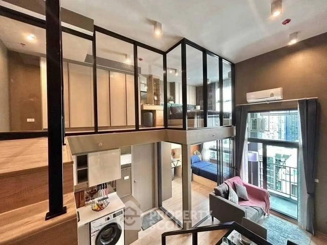 Modern loft apartment with mezzanine, open living space, and balcony view.