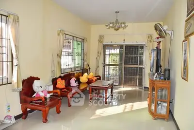 Charming living room with plush seating and ample natural light