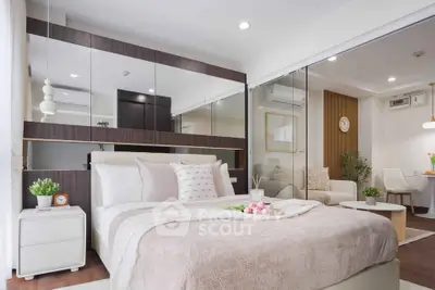 Modern bedroom with stylish decor and cozy ambiance in a contemporary apartment.