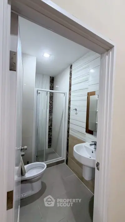 Modern bathroom with sleek shower enclosure and elegant tile design