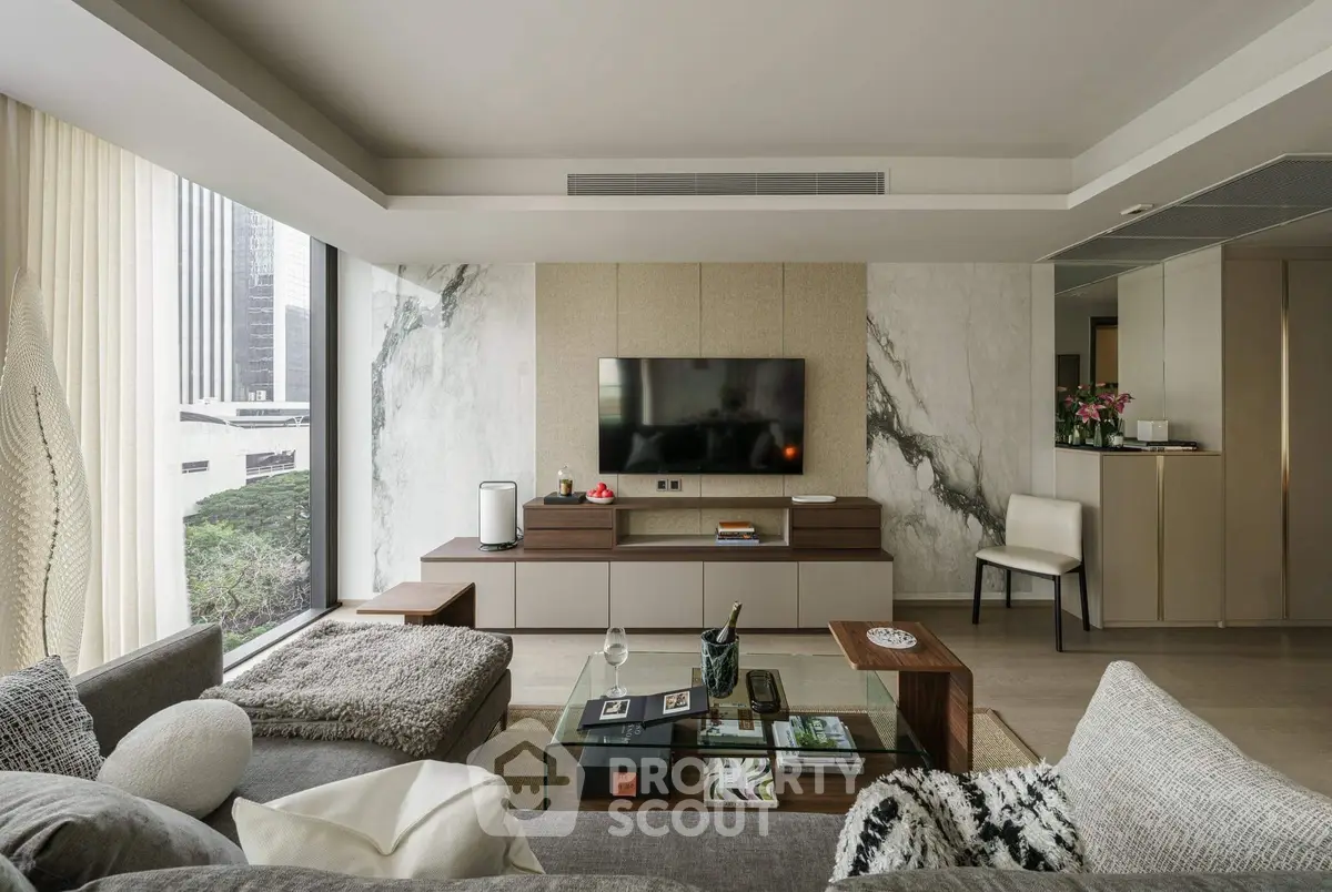 Luxurious modern living room with panoramic city view and elegant decor