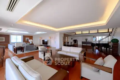 Luxurious spacious living room with elegant furniture and modern lighting