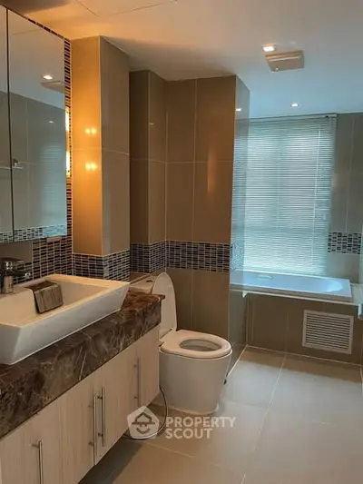 Modern bathroom with elegant fixtures and a spacious bathtub