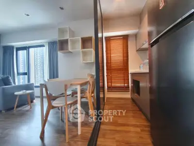 Modern open-layout kitchen and dining area with stylish decor and natural light.